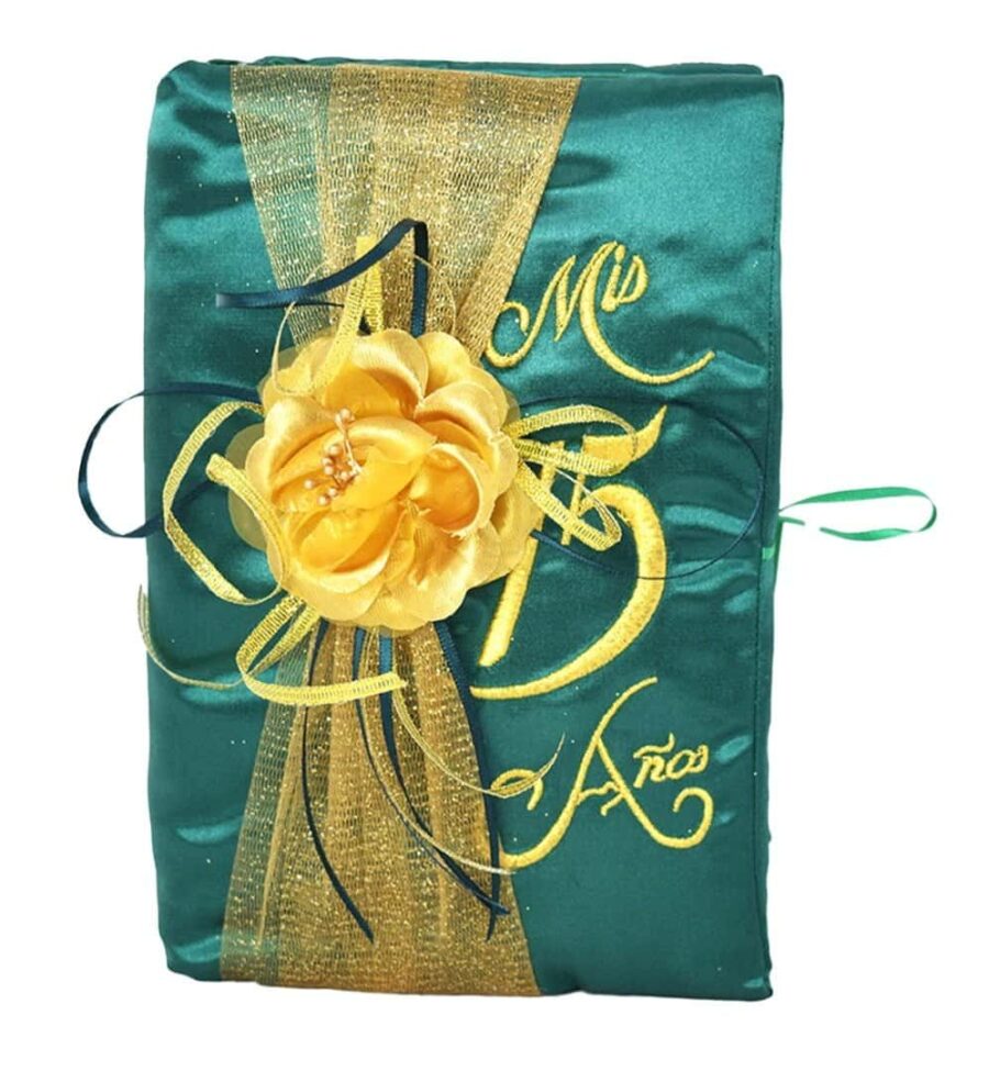 a green and gold fabric with a flower